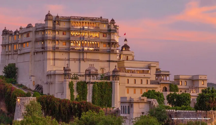 Majestic hilltop palace glowing at sunset with royal charm