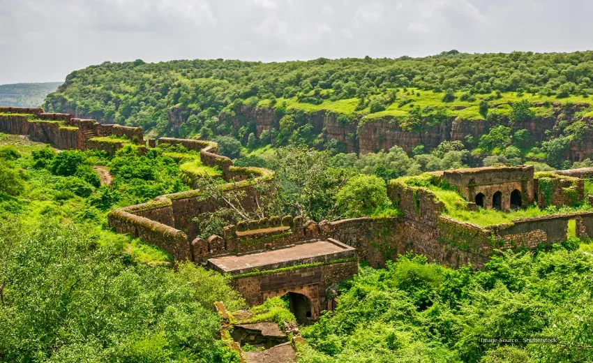 Ancient fort ruins surrounded by lush greenery, similar to historic sites explored during kenya safaris