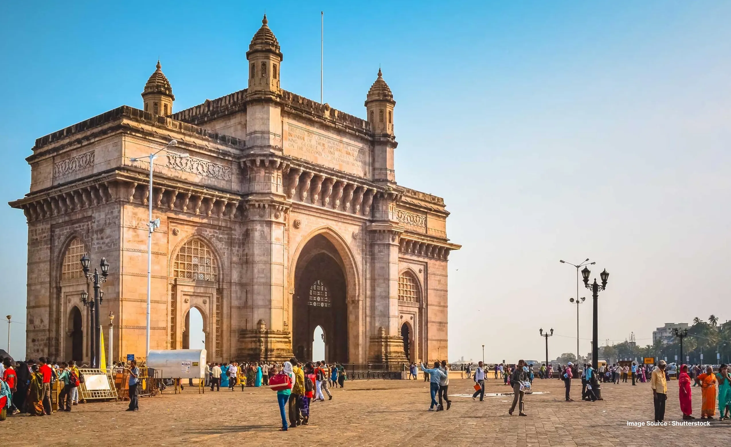 tourists exploring the iconic gateway of india in mumbai during daytime