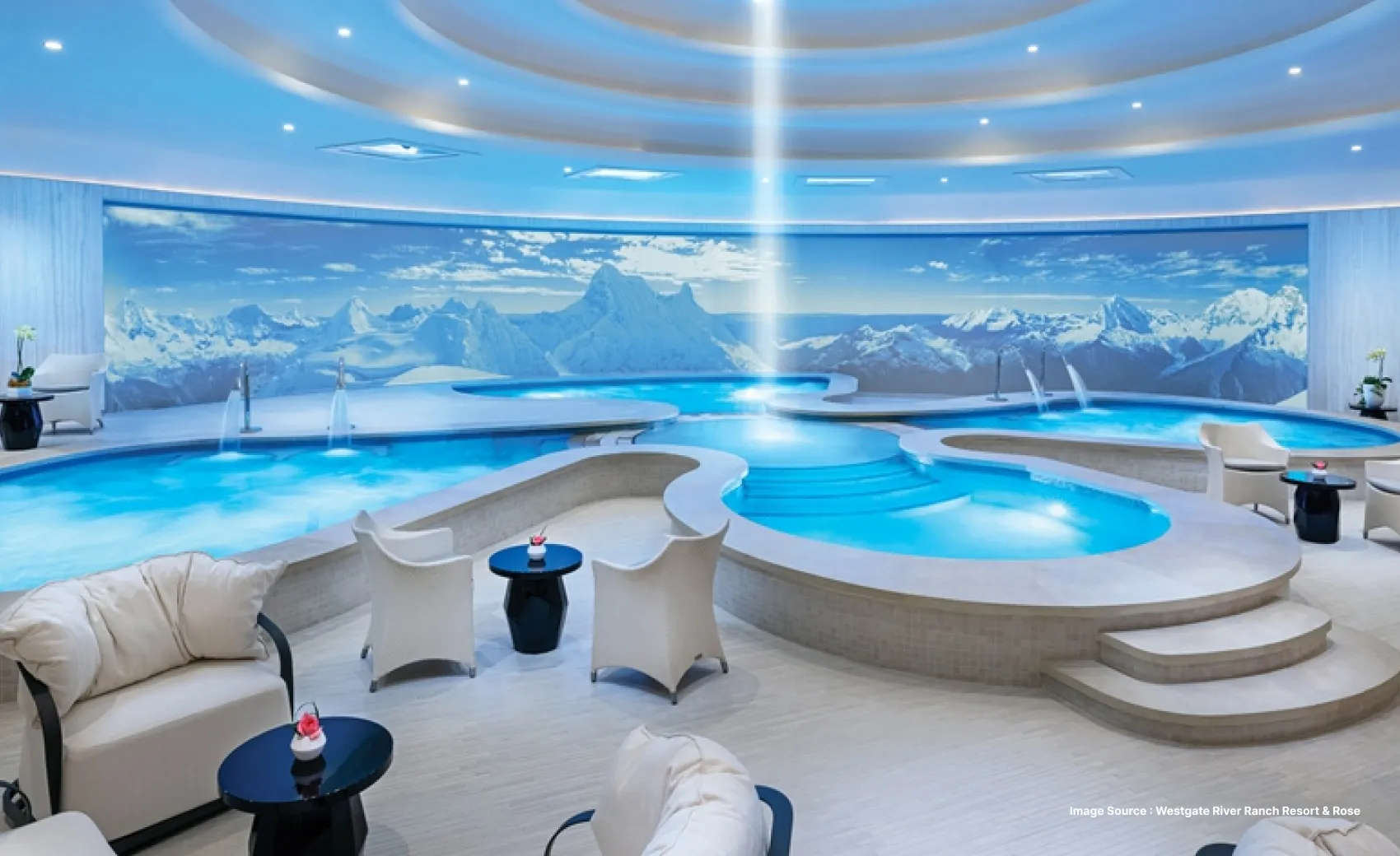 a fancy looking serene spa setting in westgate las vegas with a small pool and sofa 