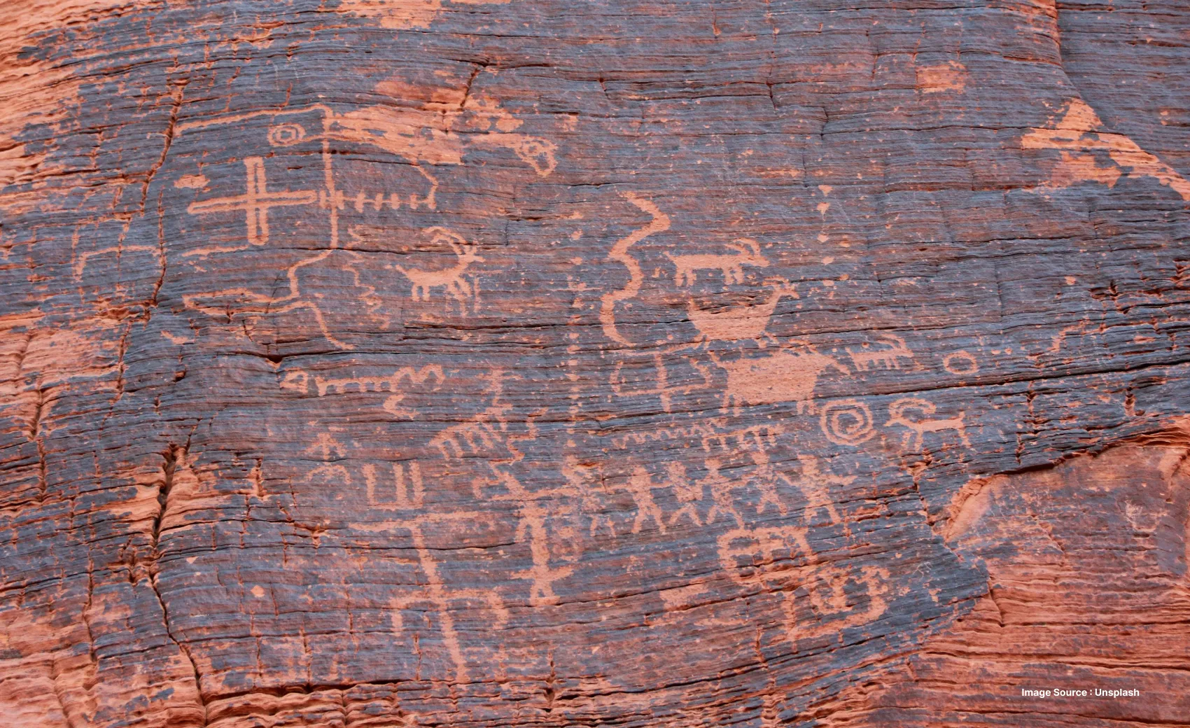 2,000 year old petroglyphs carved onto red rocks in the valley of fire
