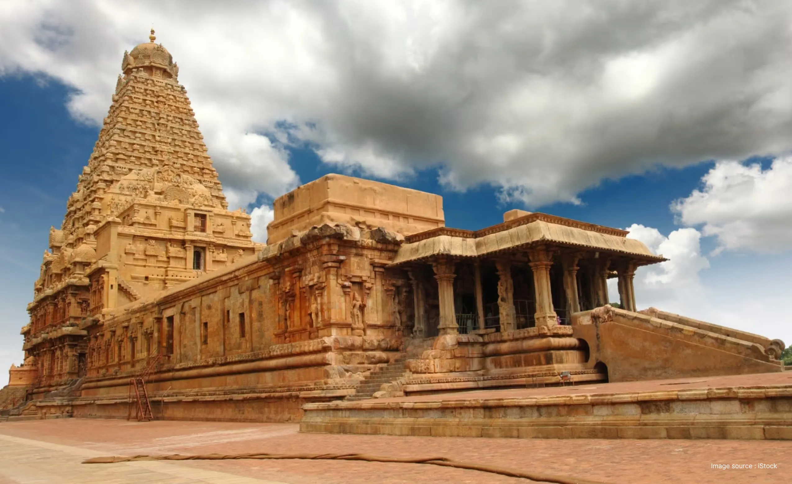 cloudy sky over the 1000 year old brihadeeswara temple in thanjavur