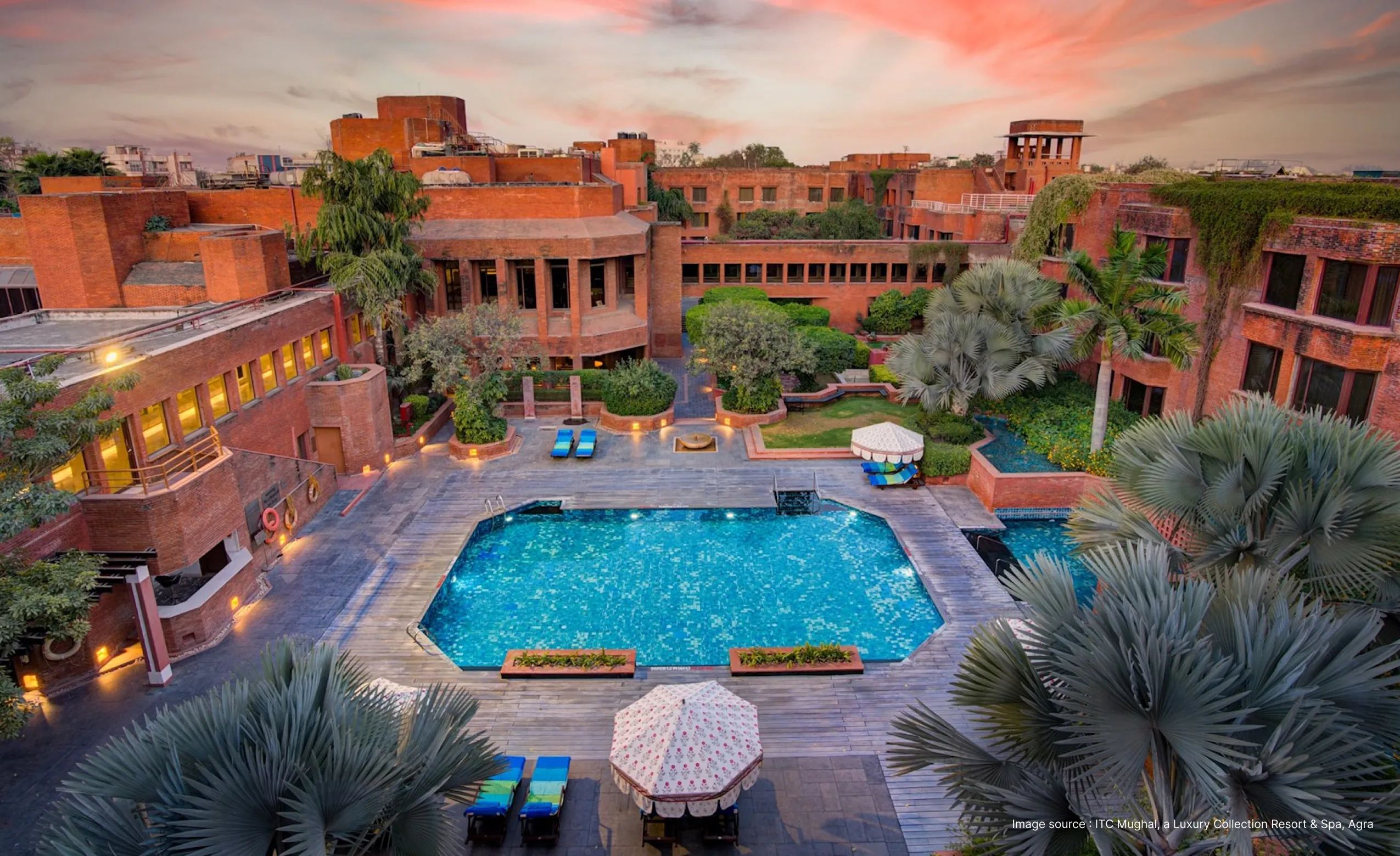 an aerial view of the pool area at the magnificent red sandstone ITC mughal hotel
