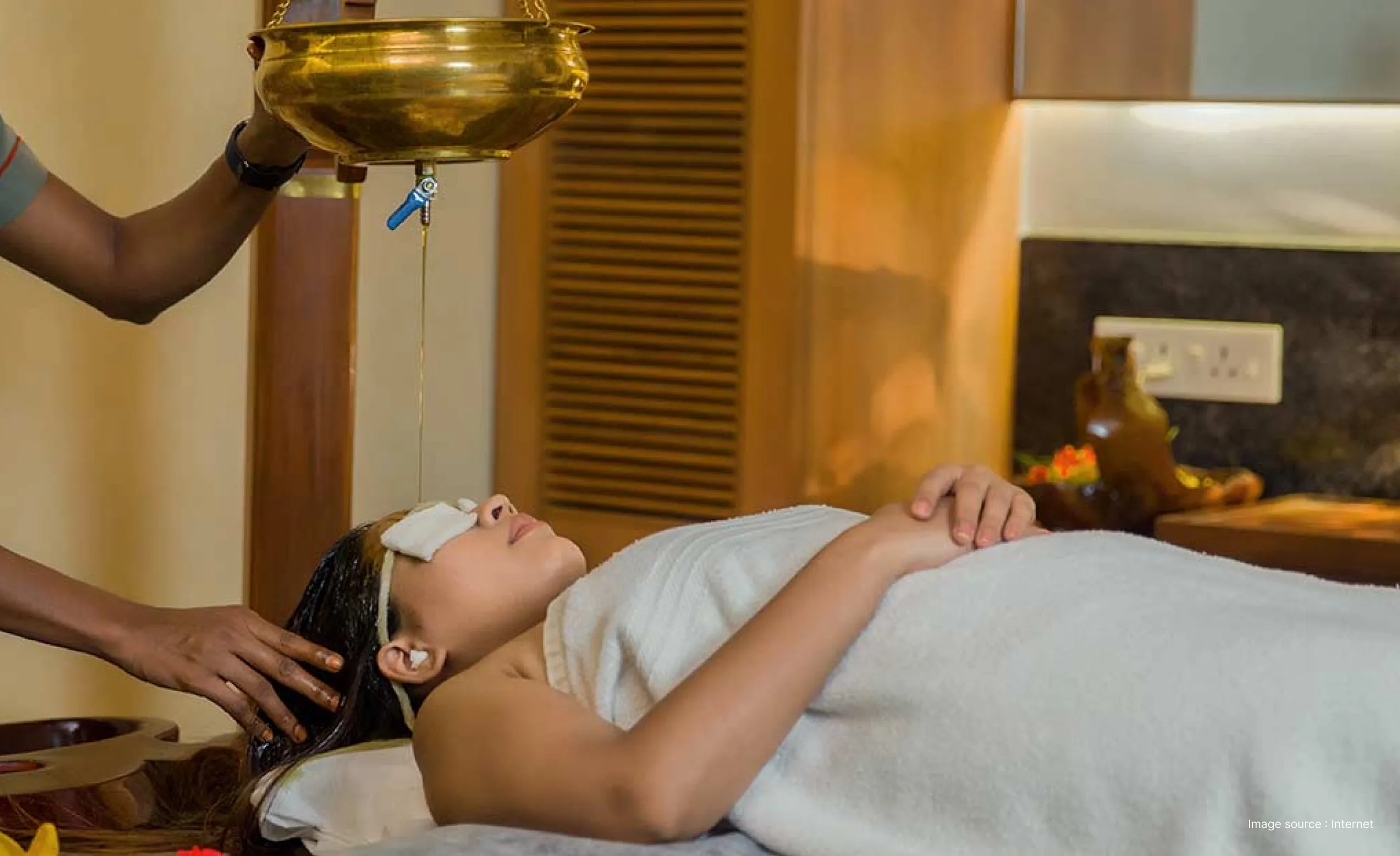 shirodhara, a relaxing ayurvedic therapy underway