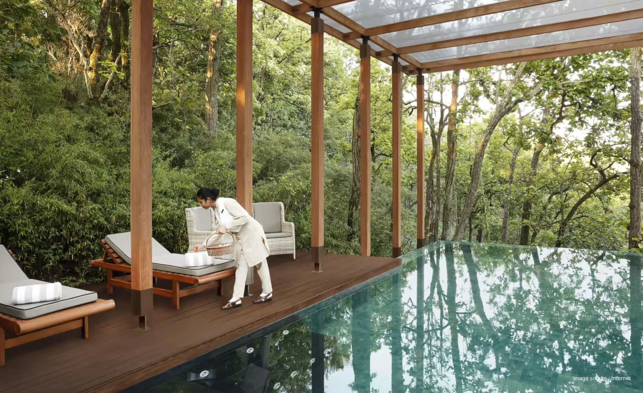 wellness resort staff fixing the lounge chairs by the pool