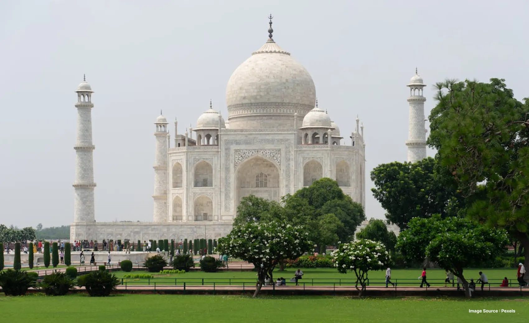 Side view of the Taj Mahal during the day with its green Garden visible