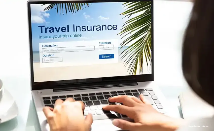 snap of a laptop's screen as a person searches for travel insurance options