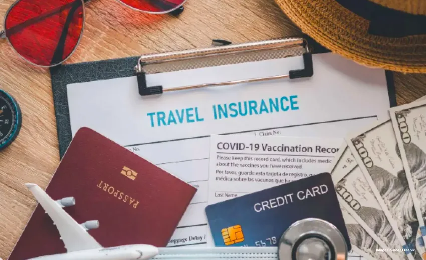 travel insurance form stuck to an exam pad with passport, sunglasses, credit card etc.