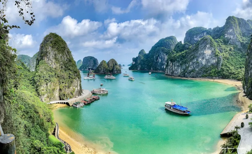 Stunning emerald bay dotted with limestone islands, crystal-clear waters, and scenic boat cruises.