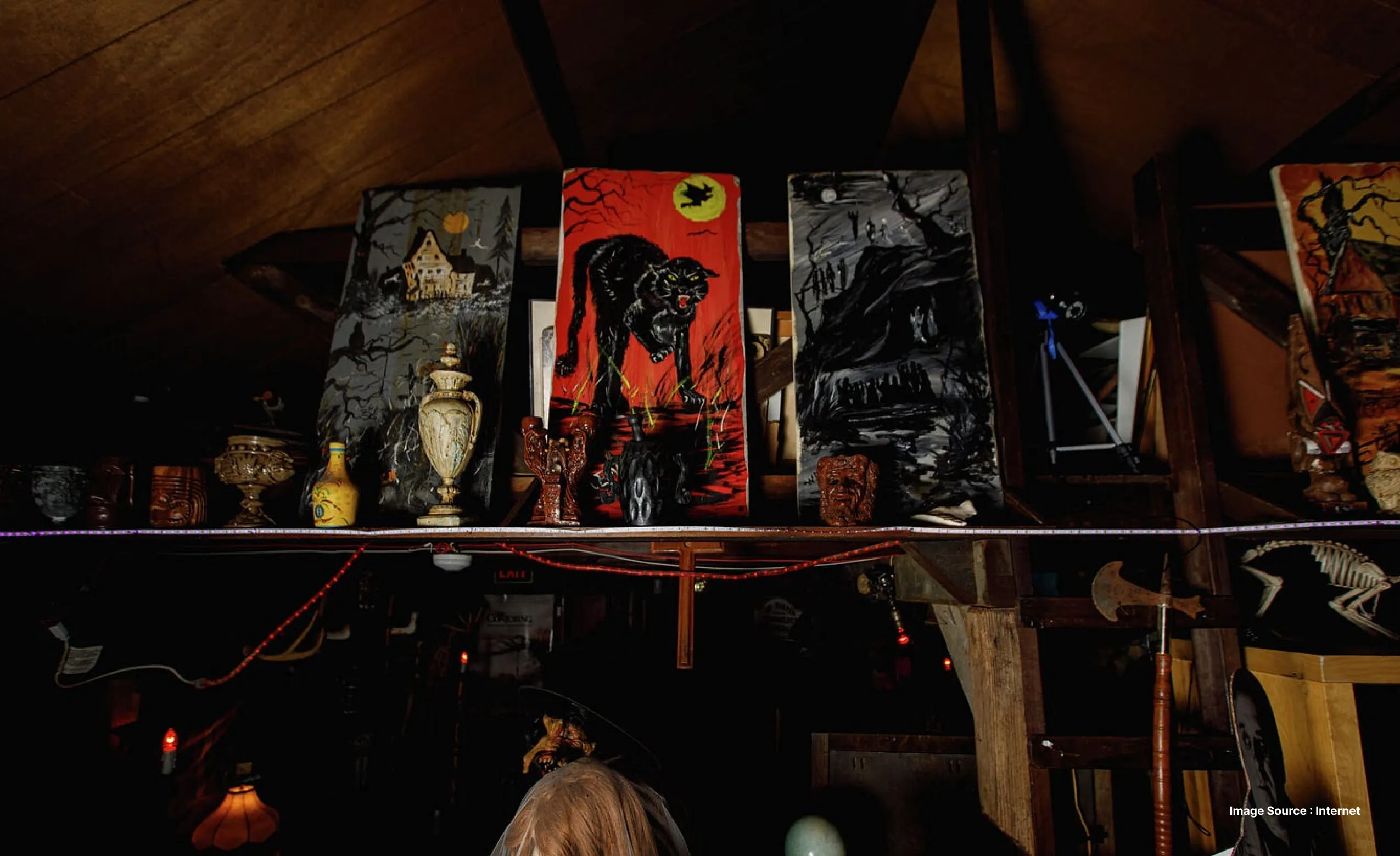 a collection of creepy and cursed items at the ed and lorraine warren museum including trophies and eerie sculptures