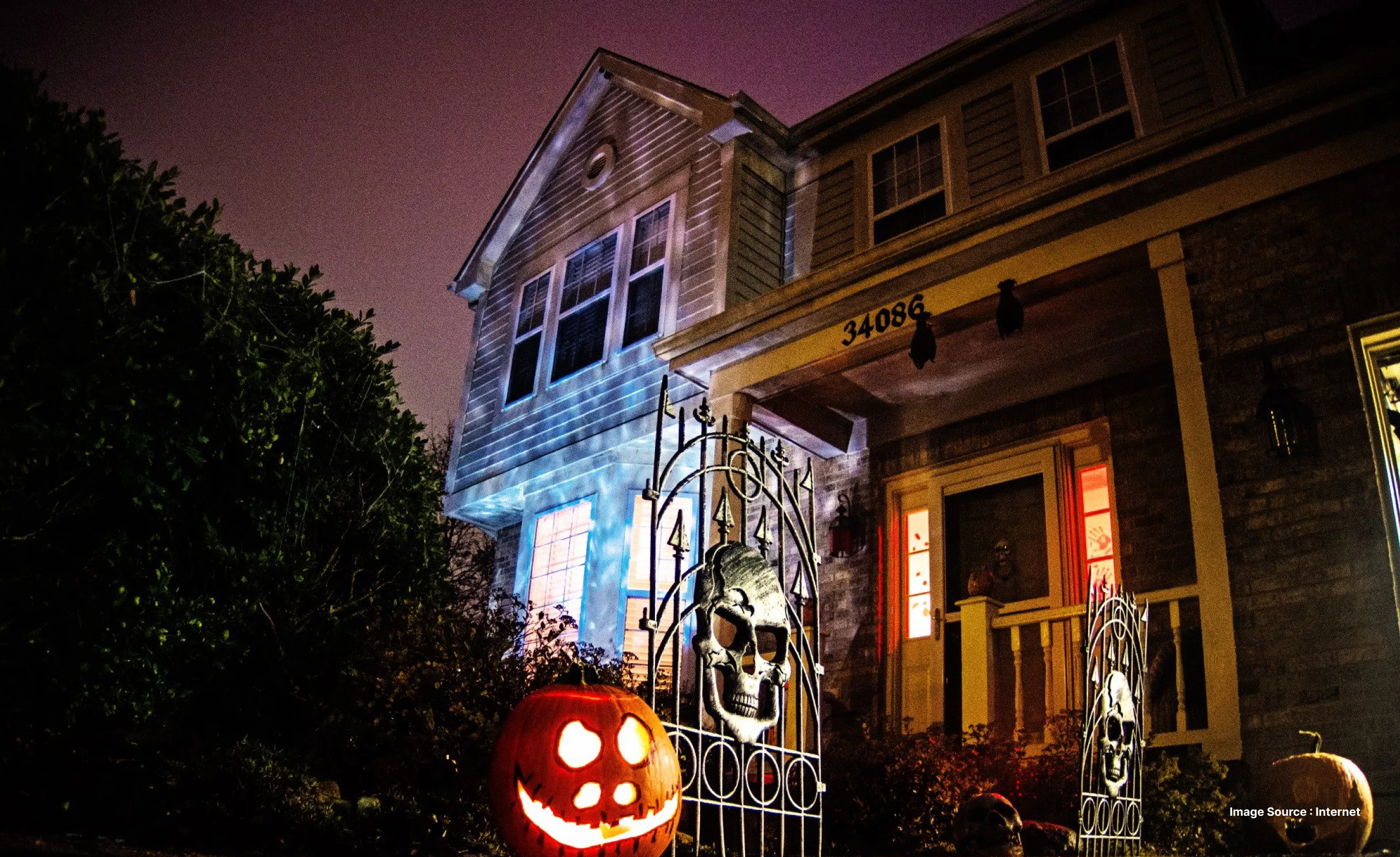 ed and lorraine warren museum lit up at night in colorful lights