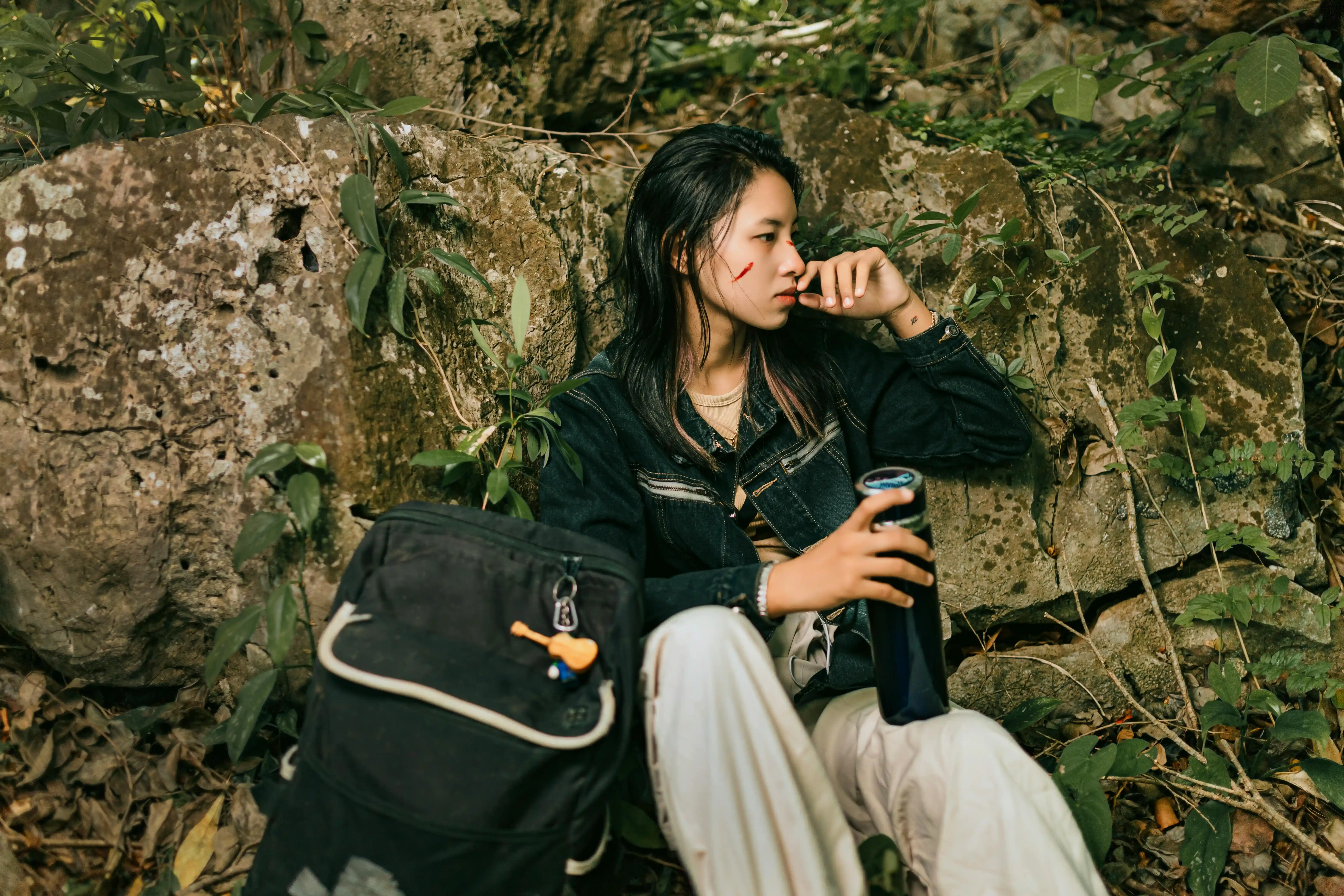 woman sitting alone in a jungle