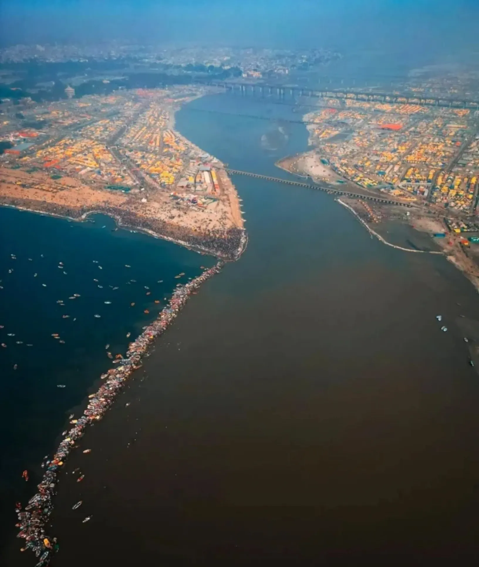 aerial shot of the trifecta rivers meeting point in india