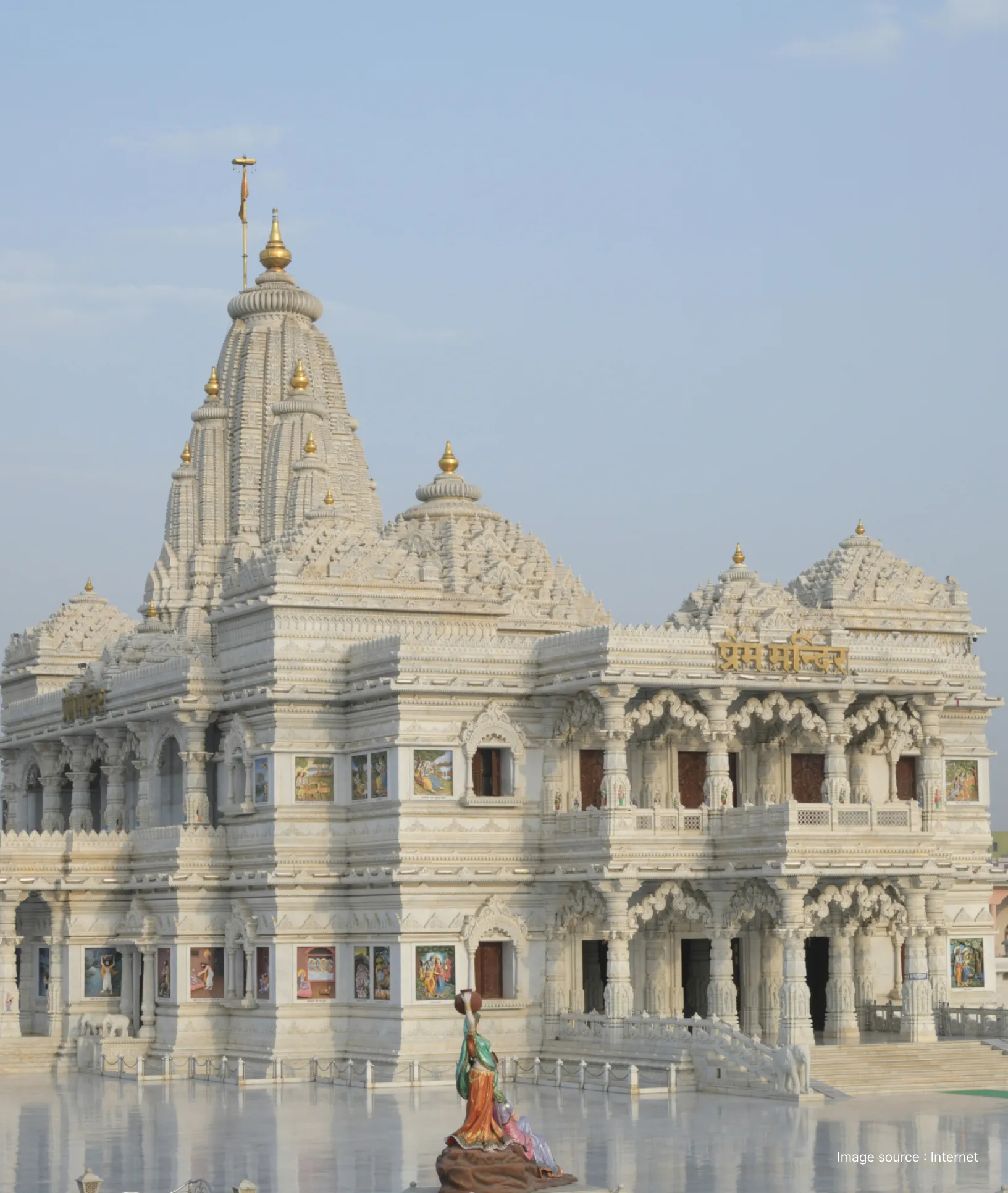 ethereal white building of the prem mandir in vrindavan with intricate carvings
