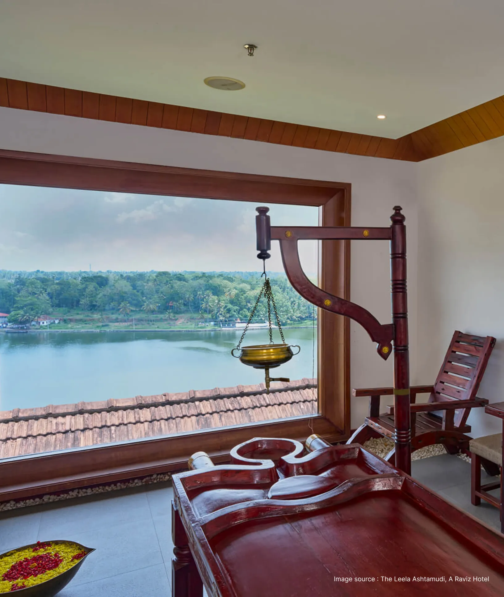 an ayurvedic spa setup with oil pot and a scenic lake view