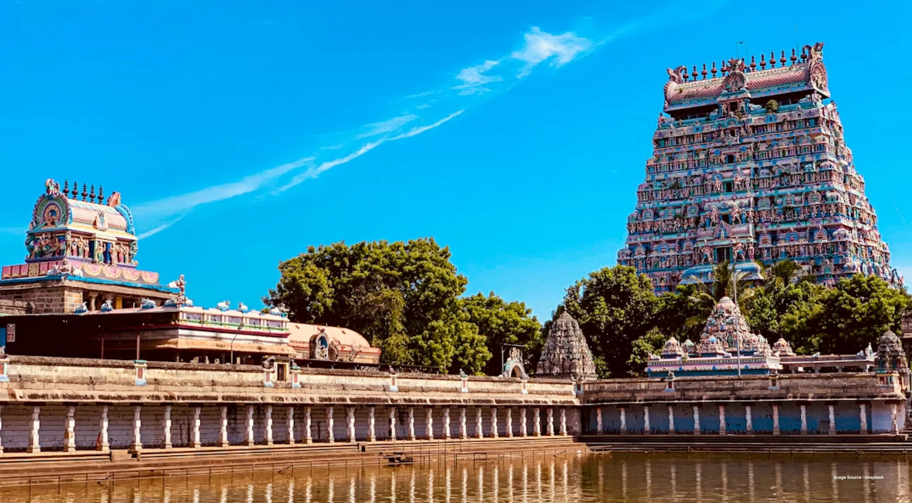 colorful temple complex with intricate sculptures on a clear sunny day