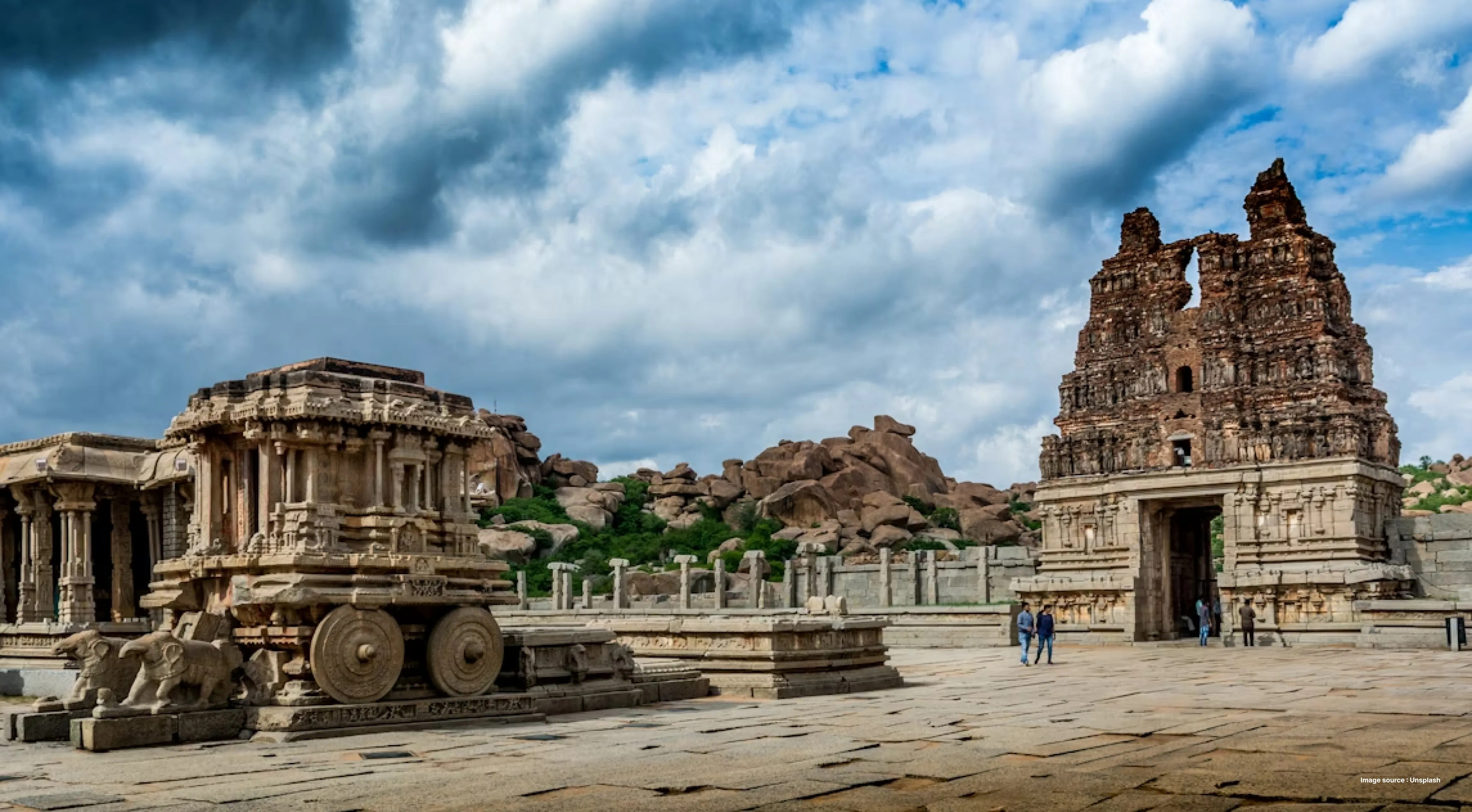 ancient rock monuments of hampi with the chariot temple and boulders in the backdrop