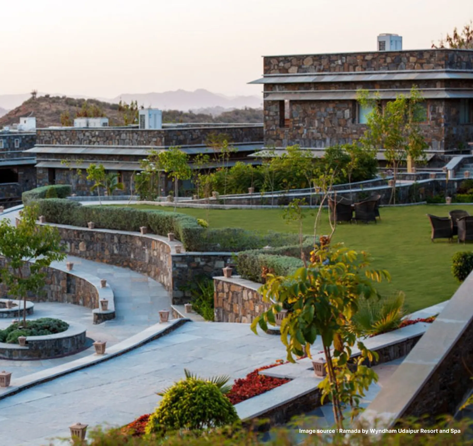 serene view of the ramada by wyndham resort in udaipur with gardens and walkways