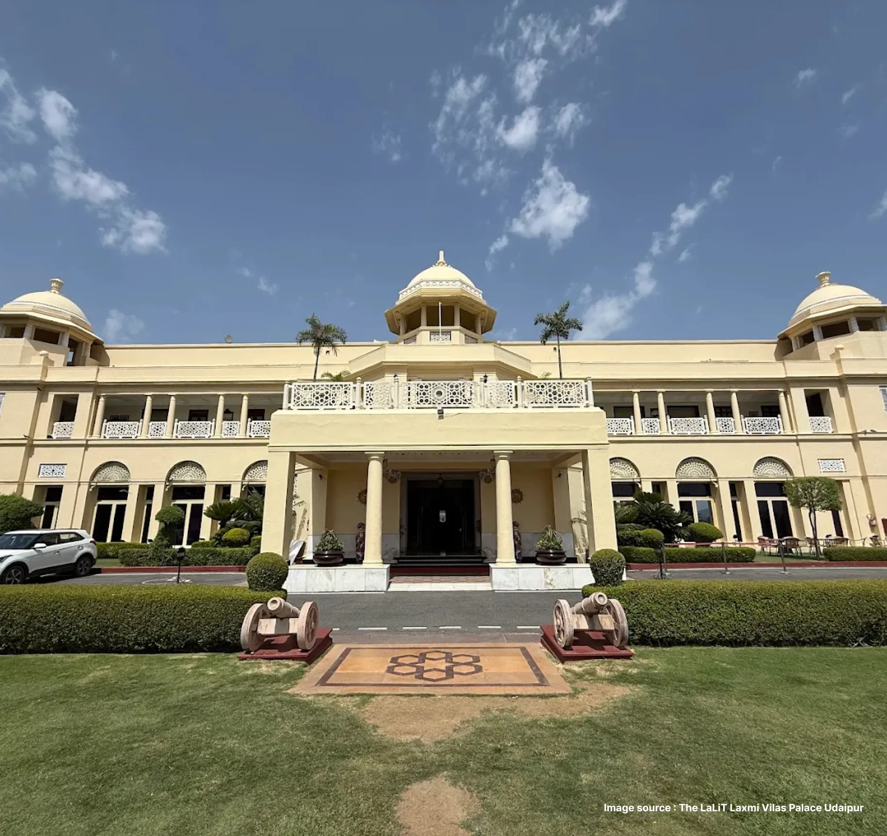 front view of the grand laxmi vilas palace in udaipur during the day