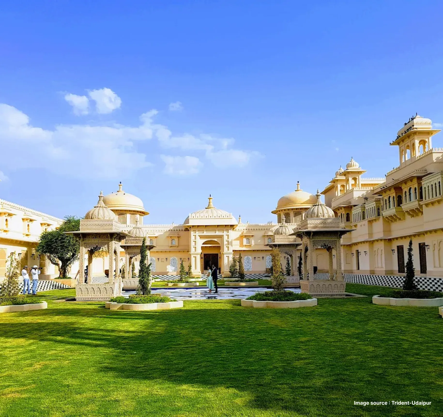 garden area view of the trident hotel in udaipur during the day