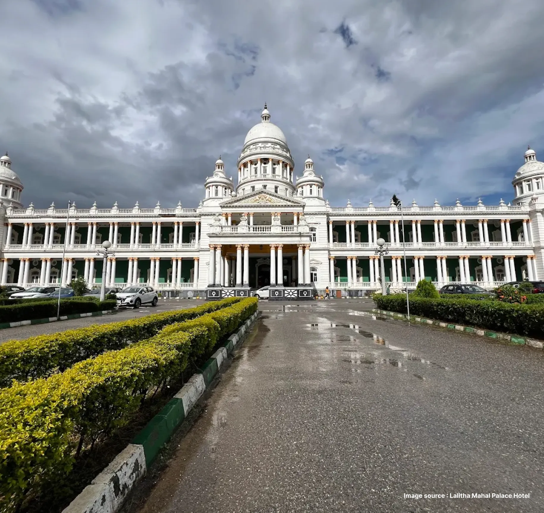the royal looking lalitha mahal palace hotel on a cloudy day with its iconic white dome