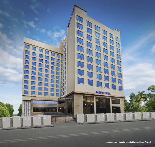 An image of Novotel Hotel standing during the day