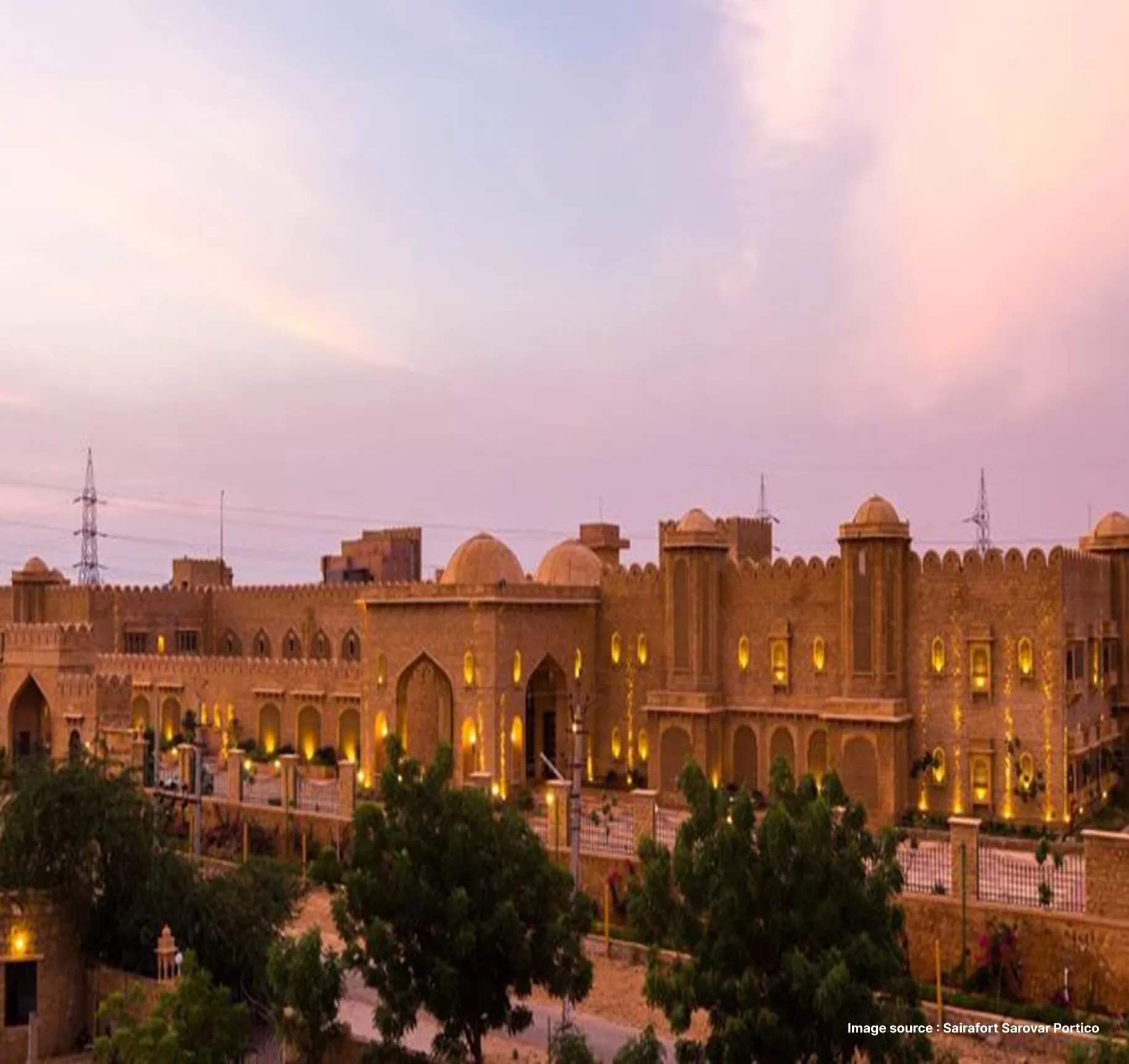 sunset view of the fort-like architecture of the sairafort hotel in jaisalmer