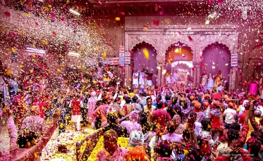 Tourists celebrating Holi in North India on a colorful cultural vacation packed with colors, laughter, and celebration of culture.