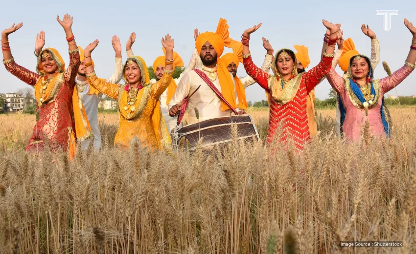  women dance in wheat fields - holi festival tour