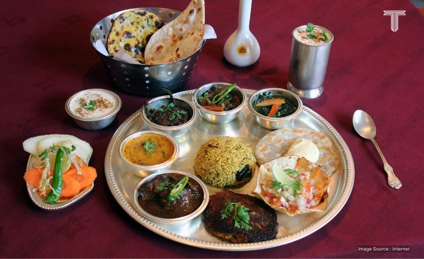 The Maharaja Feast guests of The Maharaja Restaurant set amidst the majesty of regal decor, surrounded by a live Indian classical music atmosphere.
